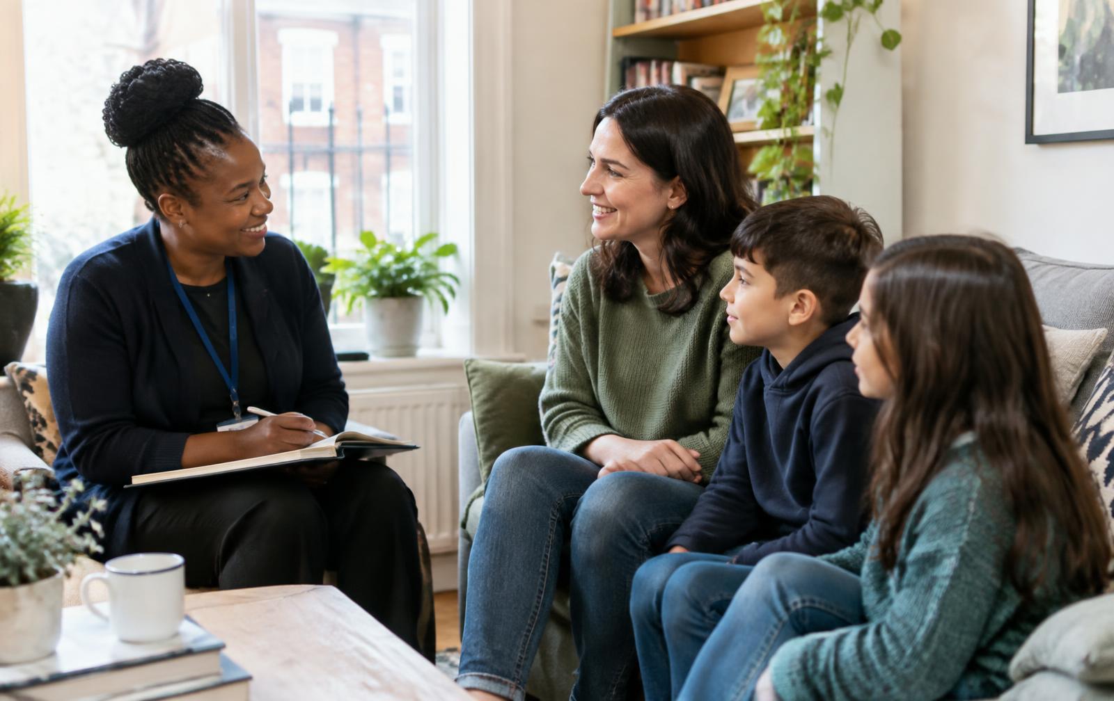Social worker talking with a family at home